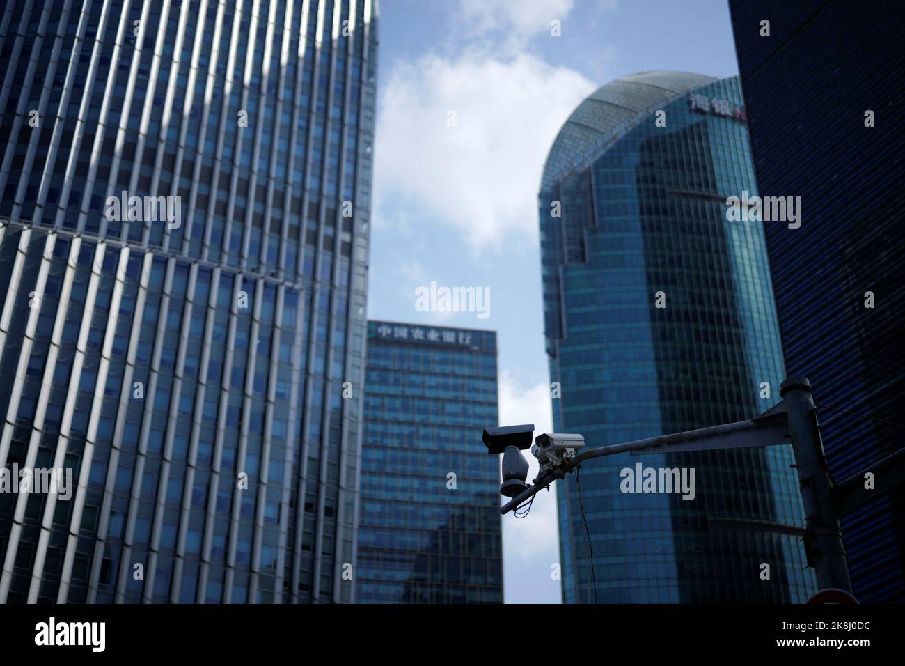 Surveillance cameras are seen in front office towers in the Lujiazui financial district, following the coronavirus disease (COVID-19) outbreak, in Shanghai, China October 17, 2022. REUTERS/Aly Song Stock Photo