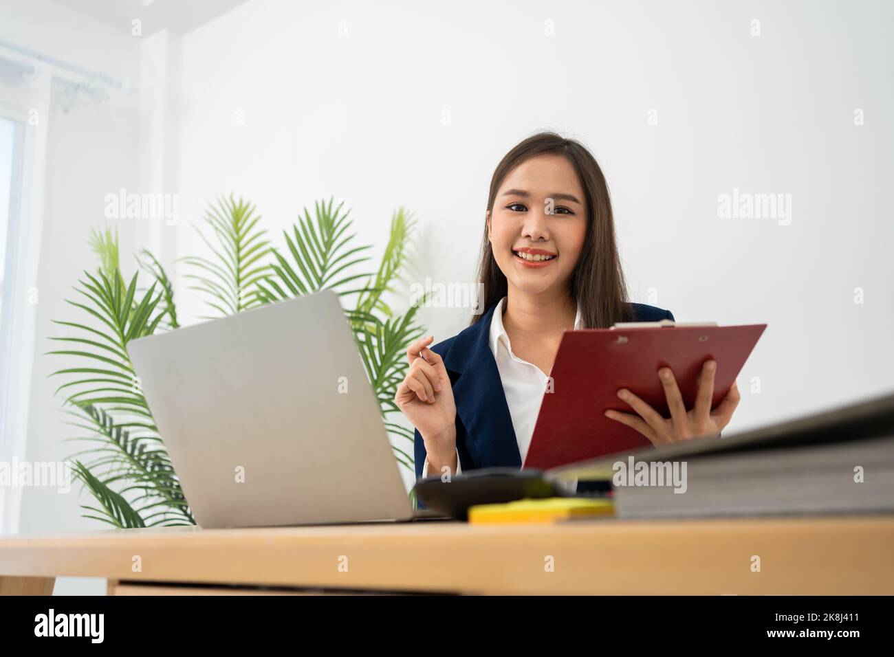 Happy young Asian women startup entrepreneur happy and excited smiling after getting email for success sign business contact, happy girl on the workpl Stock Photo
