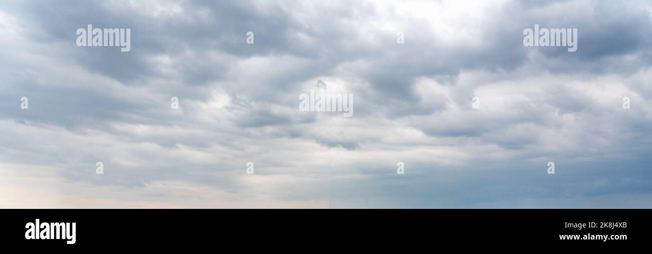 Dramatic sky background. Stormy clouds in dark sky. Moody cloudscape Stock Photo