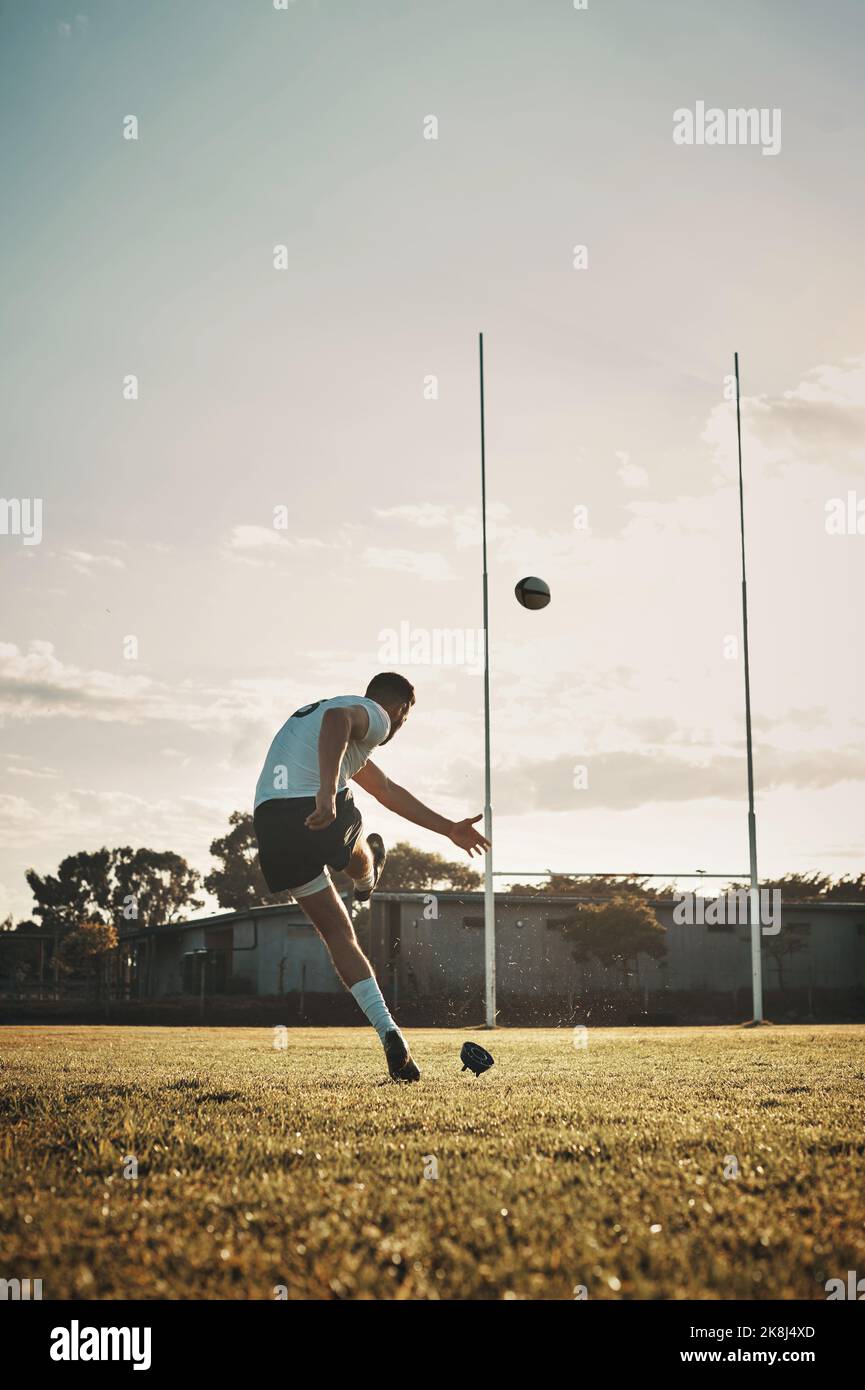 Such great kicking skills. Full length shot of a handsome young rugby