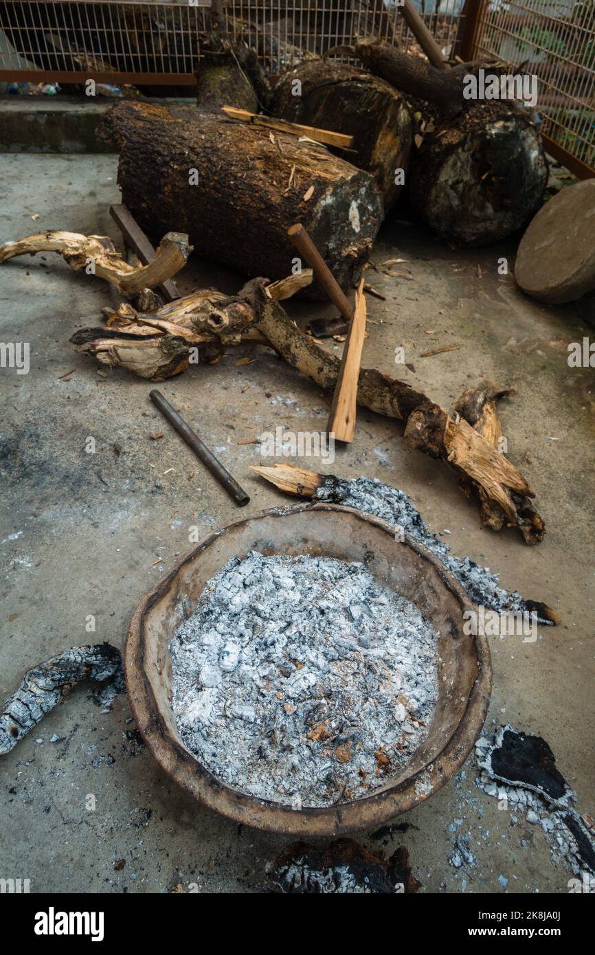 A close up shot of fire pot with ashes of wood during winter season