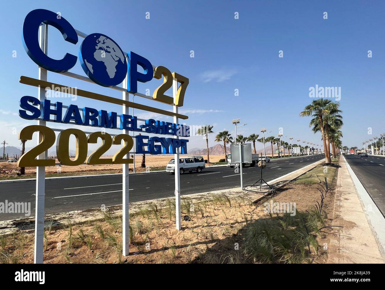 View of a COP27 sign on the road leading to the conference area in Egypt's Red Sea resort of Sharm el-Sheikh town as the city prepares to host the COP27 summit next month, in Sharm el-Sheikh, Egypt October 20, 2022. REUTERS/Sayed Sheasha Stock Photo