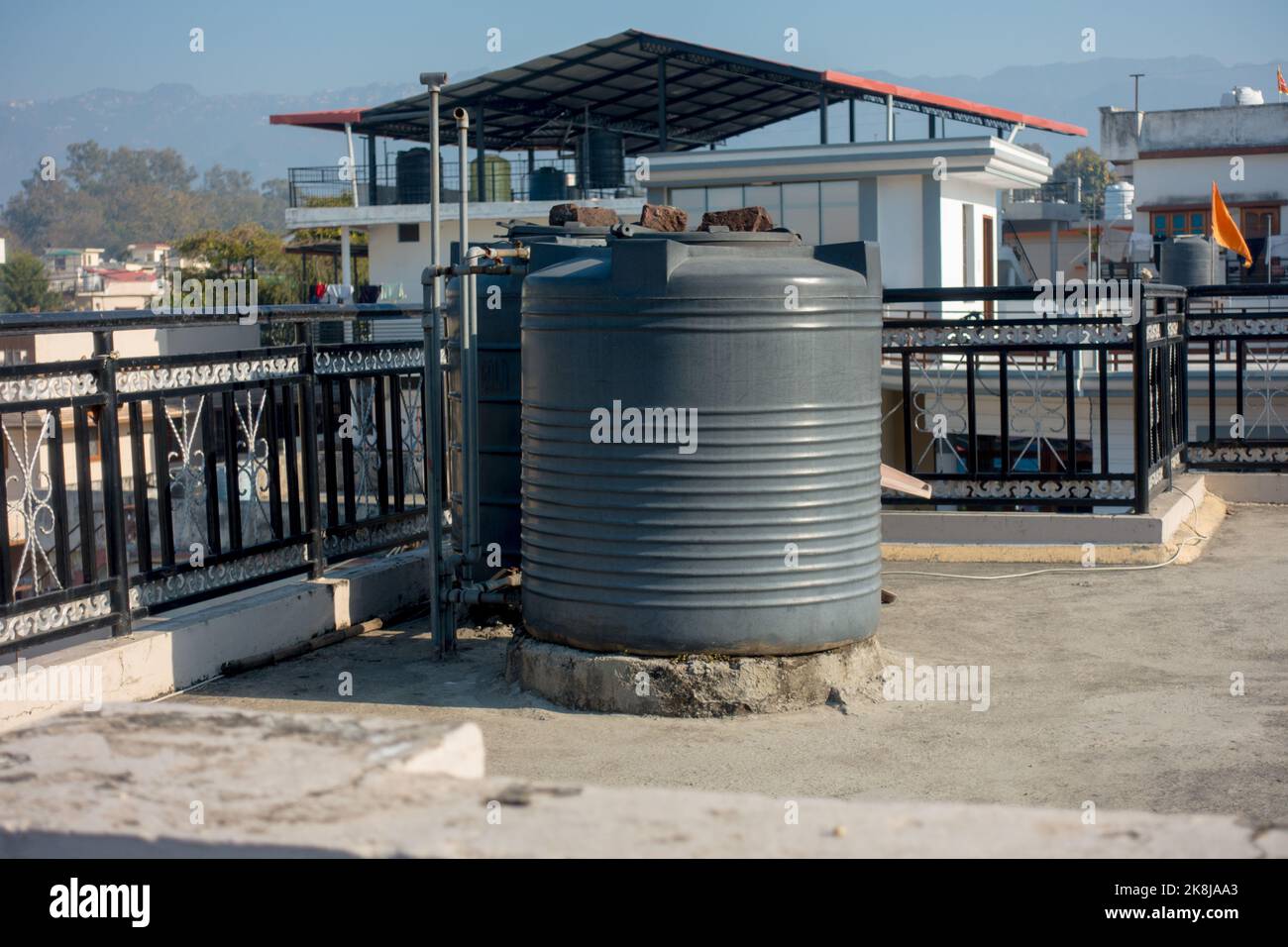 february 12th 2022, Dehradun City India. Big plastic water tanks on a roof top of a building in Urban area. Stock Photo