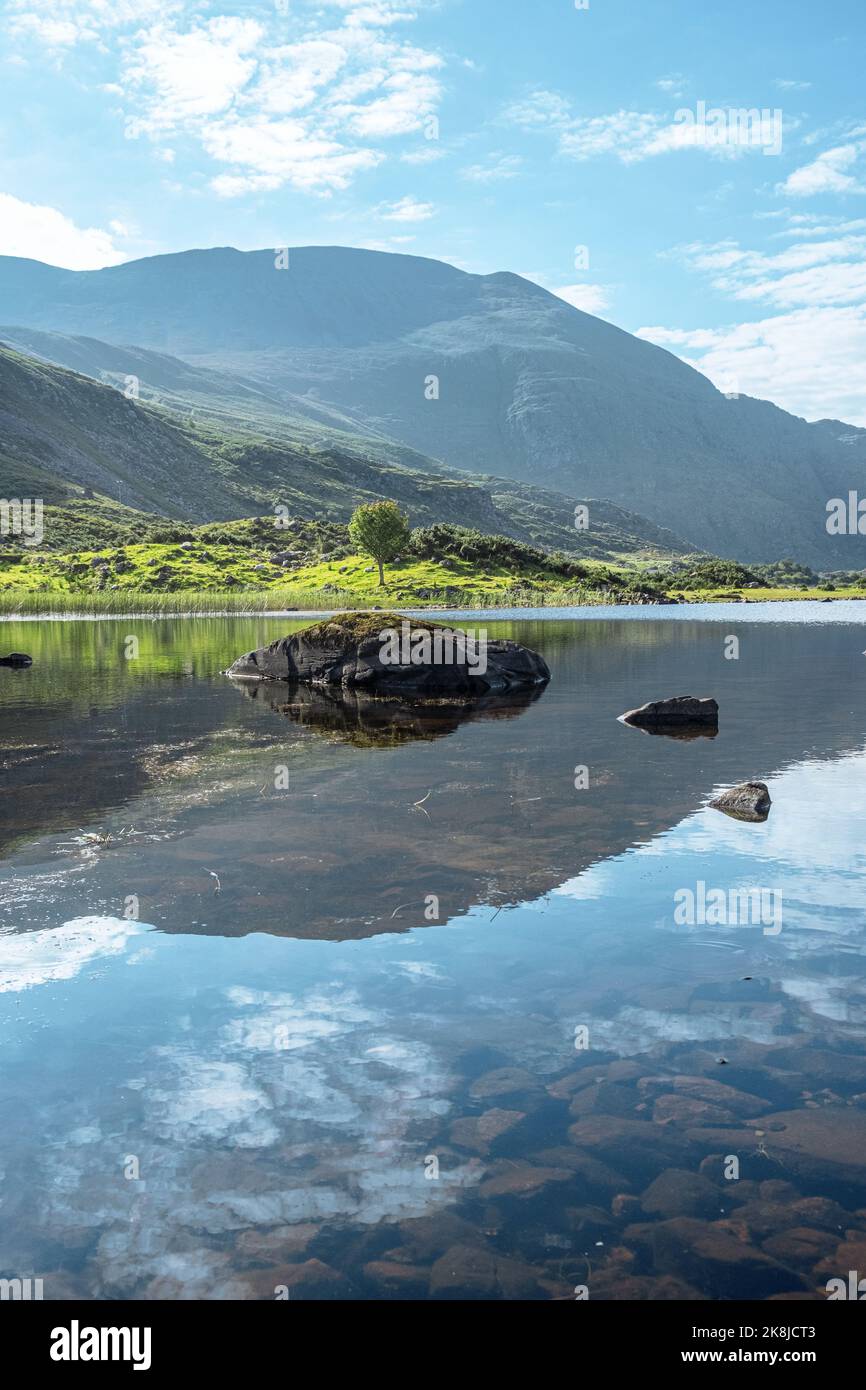 Beautiful Reflections in a calm lake, Gap of Dunloe, Ireland Stock Photo
