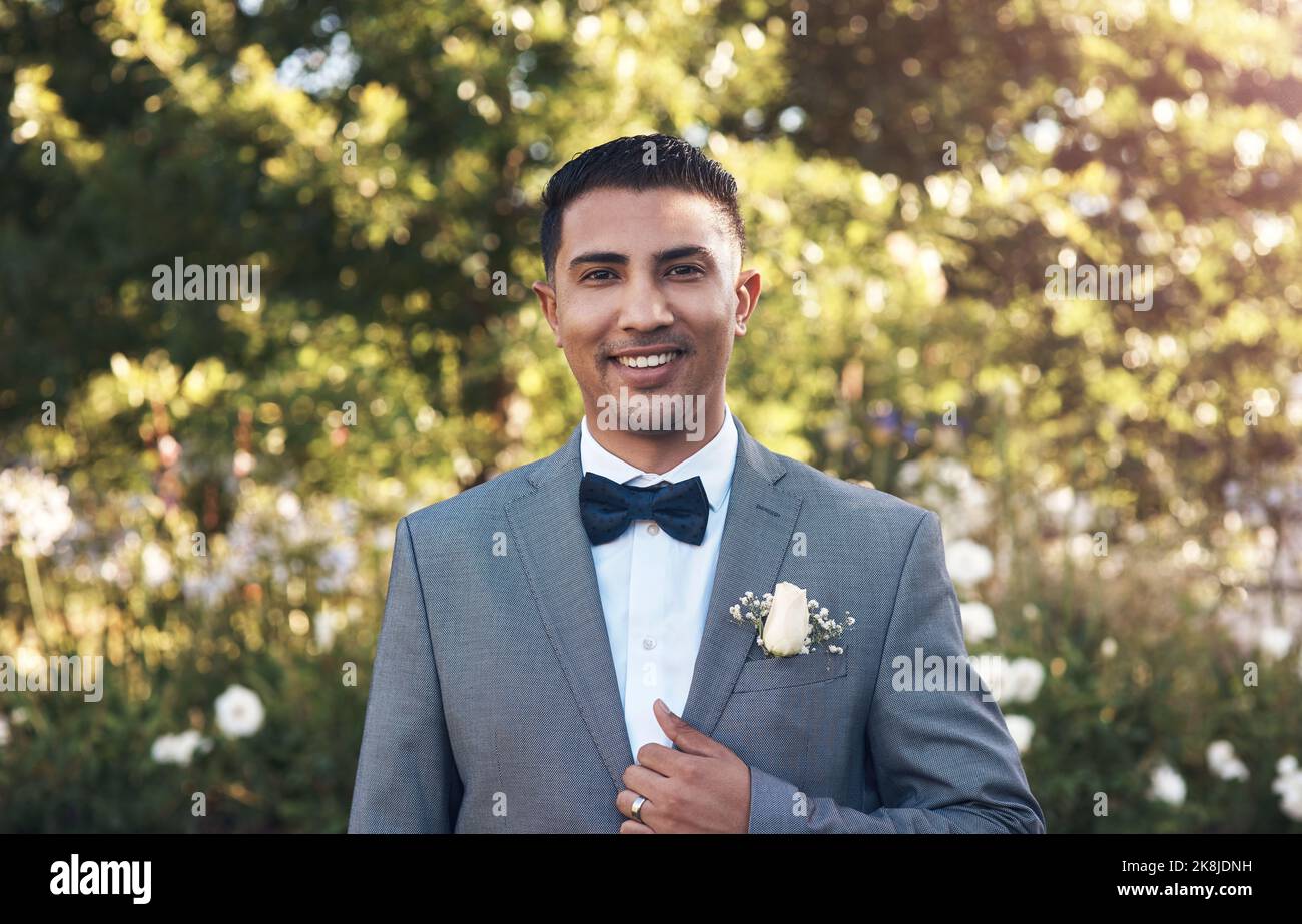 Im dressed up for a very special occasion. a a handsome young bridegroom standing outside. Stock Photo