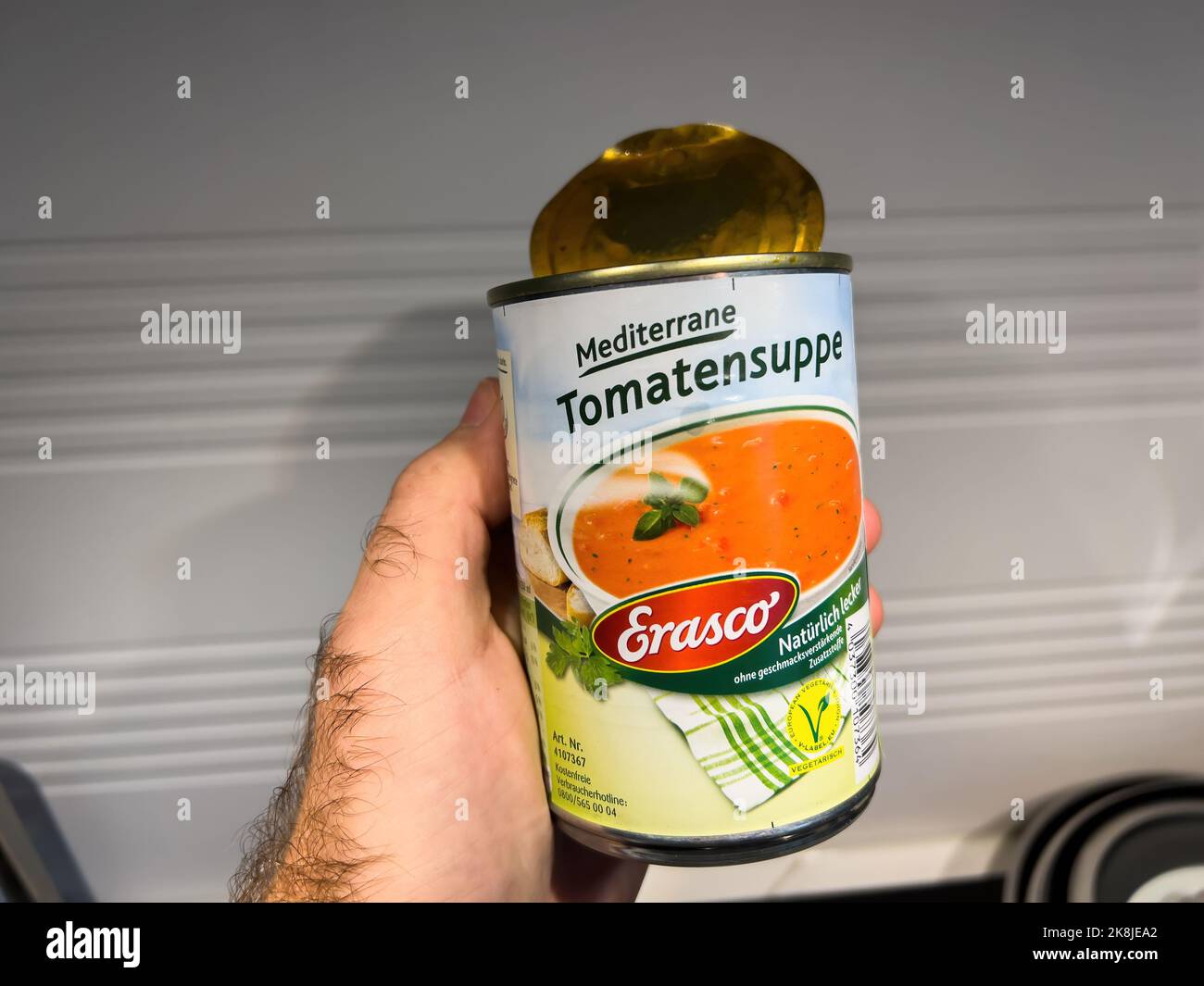 Paris, France Oct 21, 2022 POV male hand holding metallic tin can