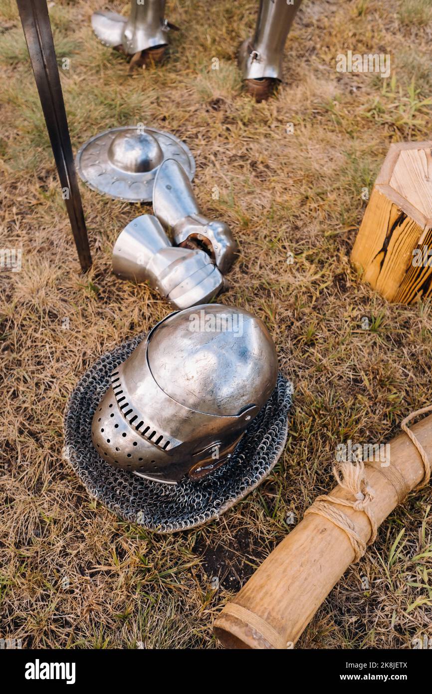 Knight's helmet, sword and battle horn on the ground Stock Photo Alamy