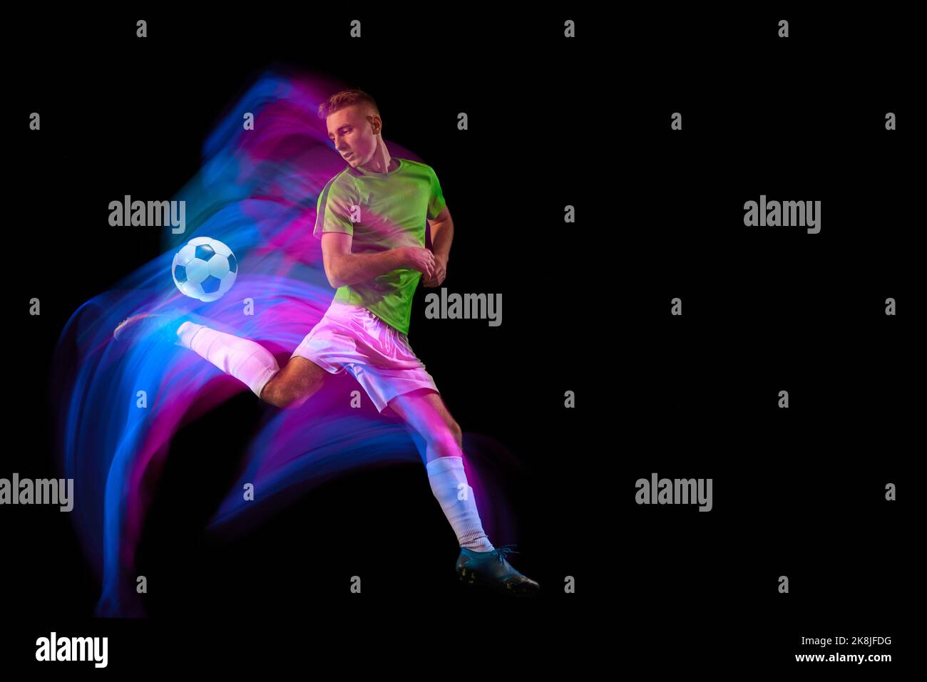 Sport in action. One man professional soccer player training with