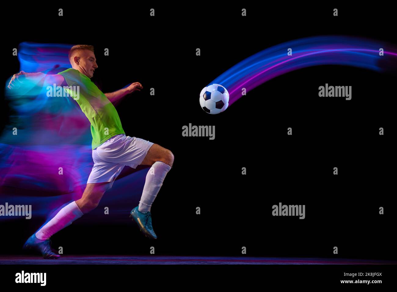 Sport in action. One man professional soccer player training with