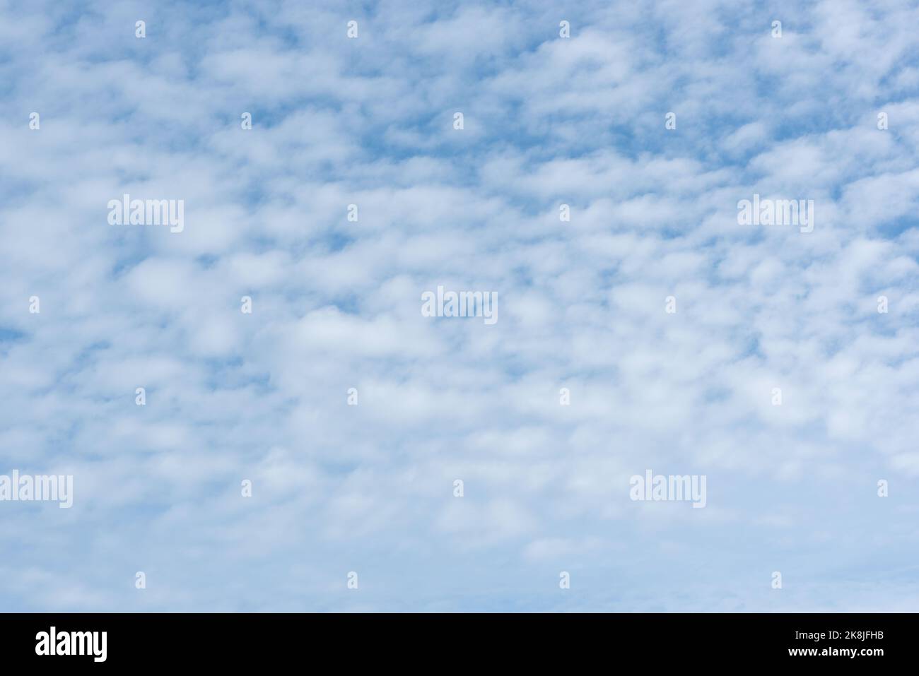 Fluffy clouds and blue sky background. Stock Photo