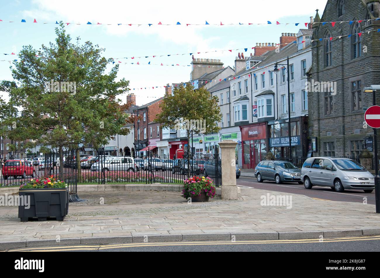 Street scene, Tynemouth, Tyne and Wear, Northumberland; shops; cars; Stock Photo