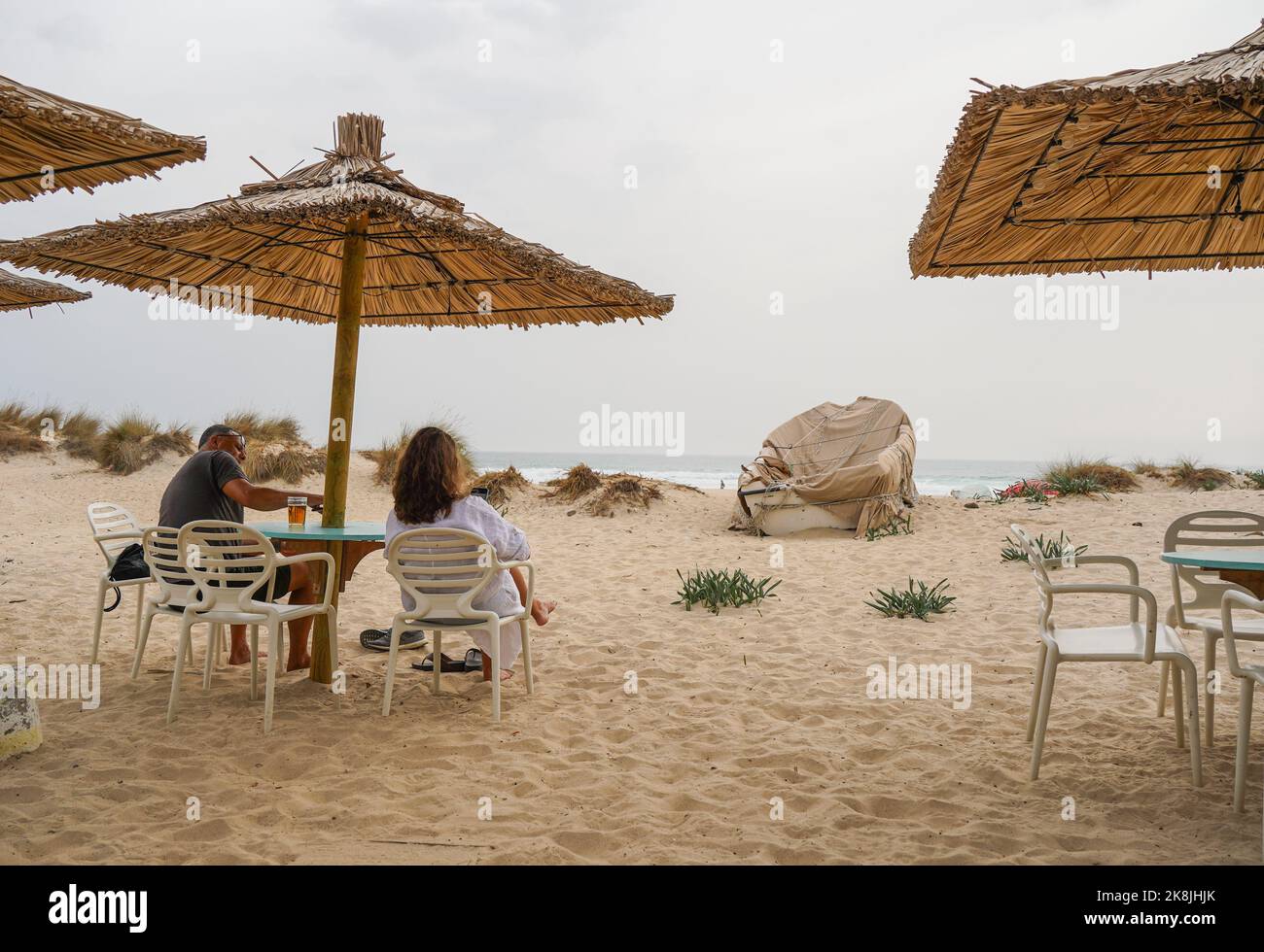 People on beach terrace in low season, Zahara de los Atunes, Cadiz, Spain. Stock Photo