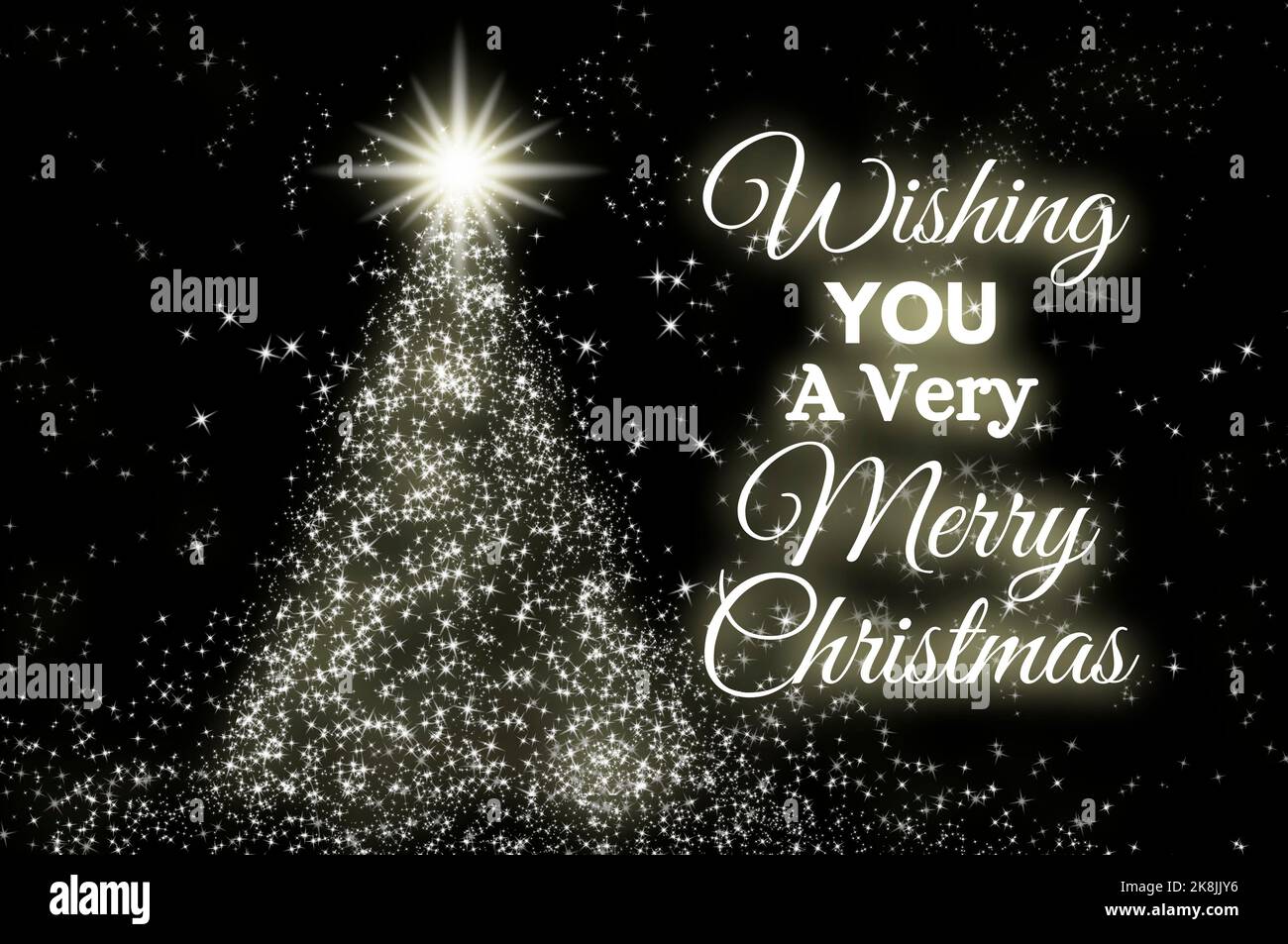 Wishing you a very Merry Christmas text on dark background with shining star like pine tree. Christmas celebration concept. Stock Photo