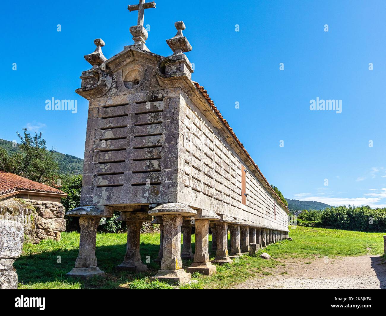 The long and narrow grain store, horreo at Carnota in Galicia, Spain. This particular horreo is claimed to be the region's largest complete and origin Stock Photo