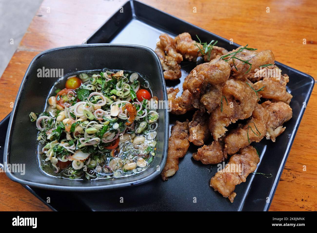 Close up battered and deep fried fish with herbal sauce Stock Photo Alamy