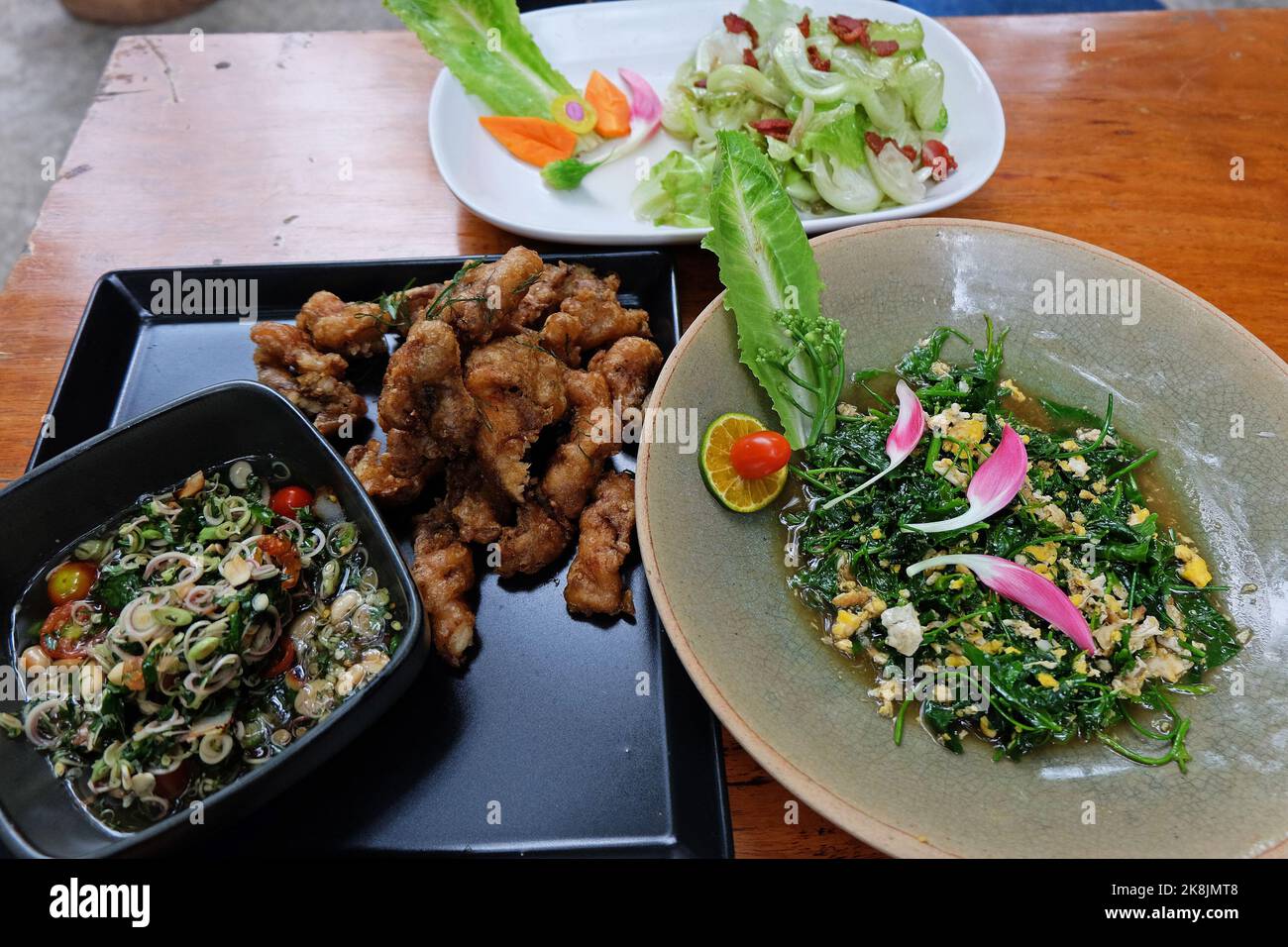 Battered and deep fried fish with herb sauce, Stir fry Malindjo leaves ...