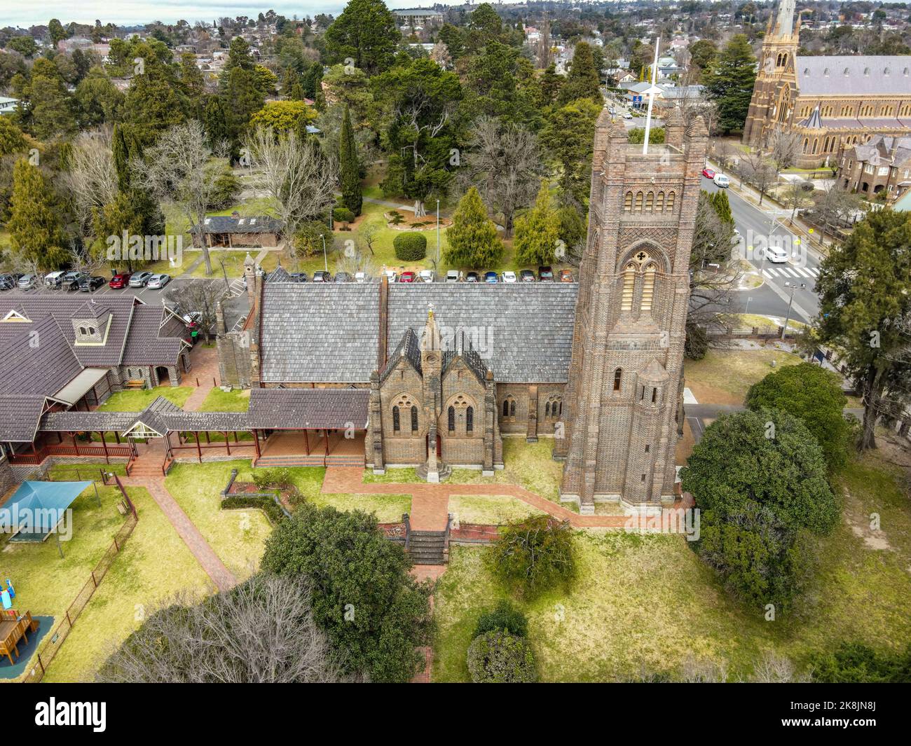 An aerial view of St Peter's Anglican Cathedral in Armidale surrounded by green trees Stock