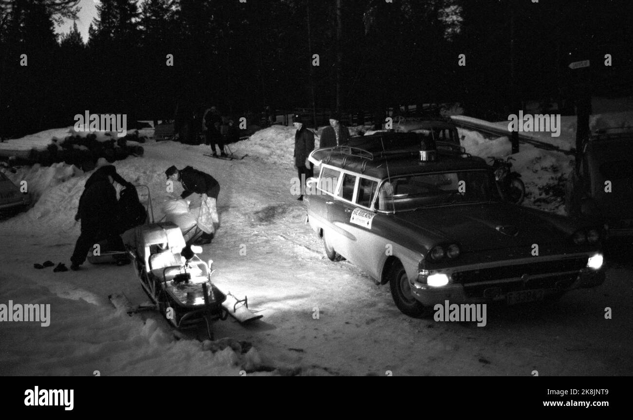 Golsfjellet, Easter 1962: Eight thousand takes care. The Red Cross is in readiness in the Easter mountain. A young girl has got appendicitis in the mountains. The Red Cross moved out with the corps' snowmobile. The girl was driven on sled down to the road, where the Gol Relief Corps ambulance picked her up. Photo: Bjørn Bjørnsen / Current / NTBSCANPIX. Stock Photo