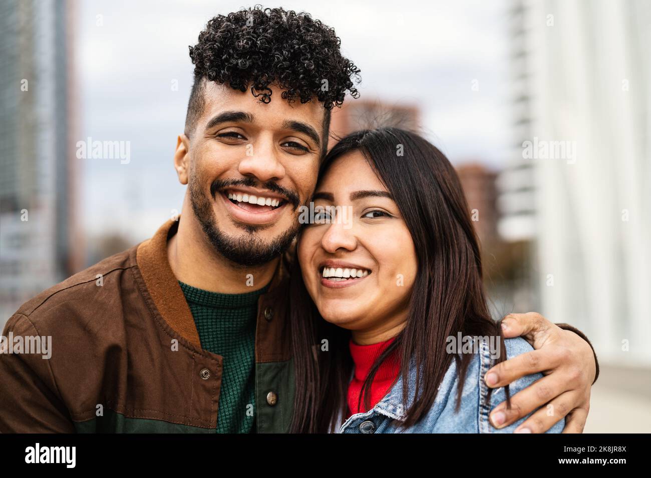 Happy young Hispanic Latin couple having fun dating outdoor Stock Photo