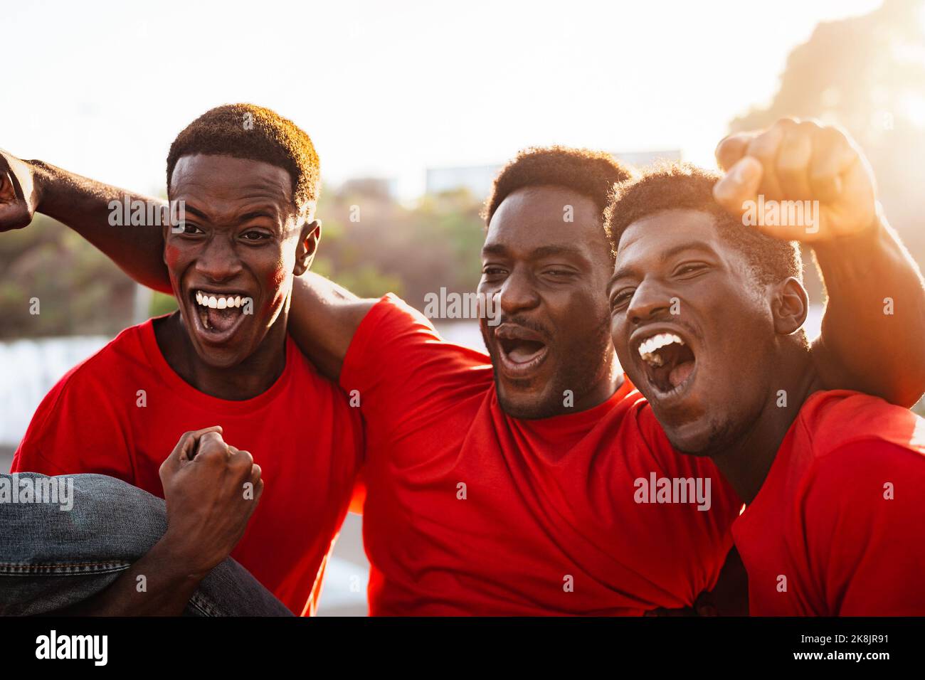 African football fans having fun supporting their favorite team - Sport entertainment concept Stock Photo