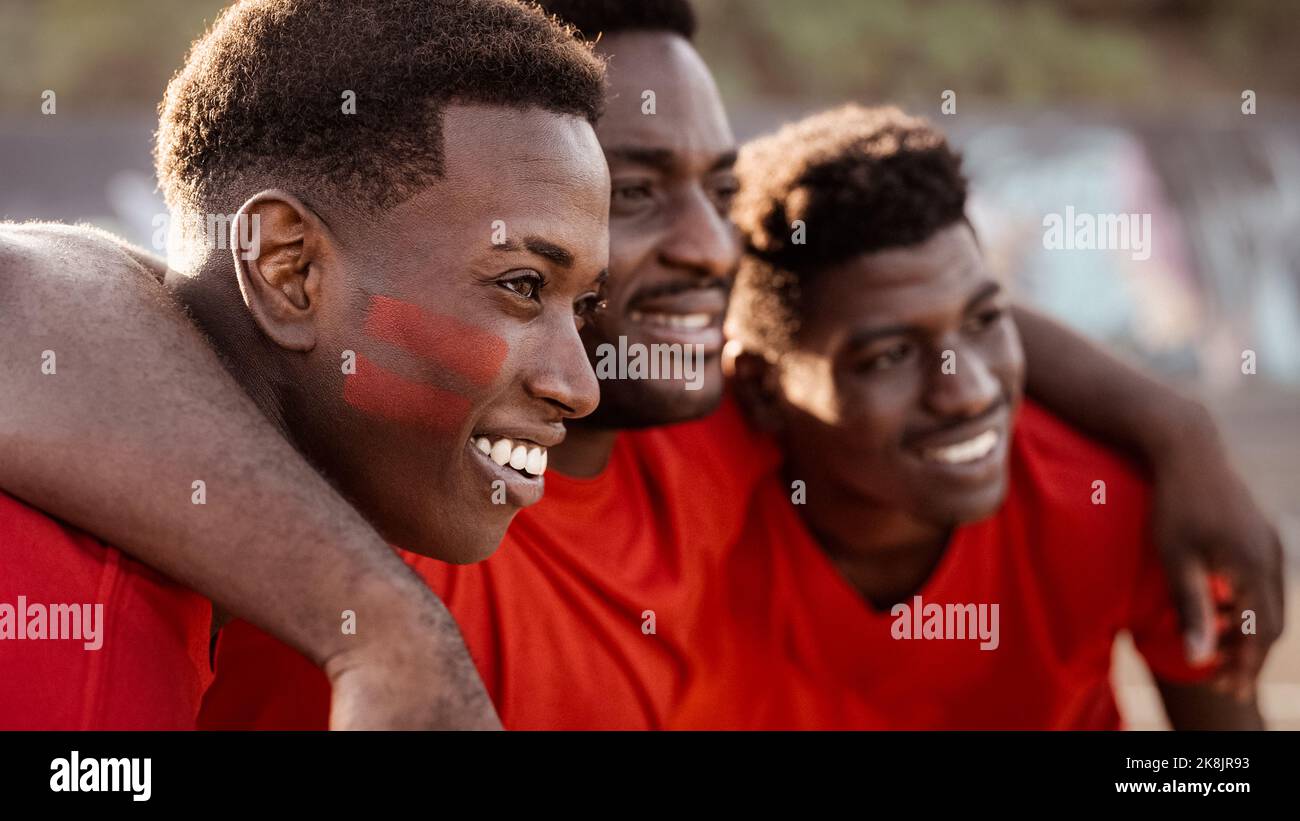 African football fans having fun supporting their favorite team - Sport entertainment concept Stock Photo