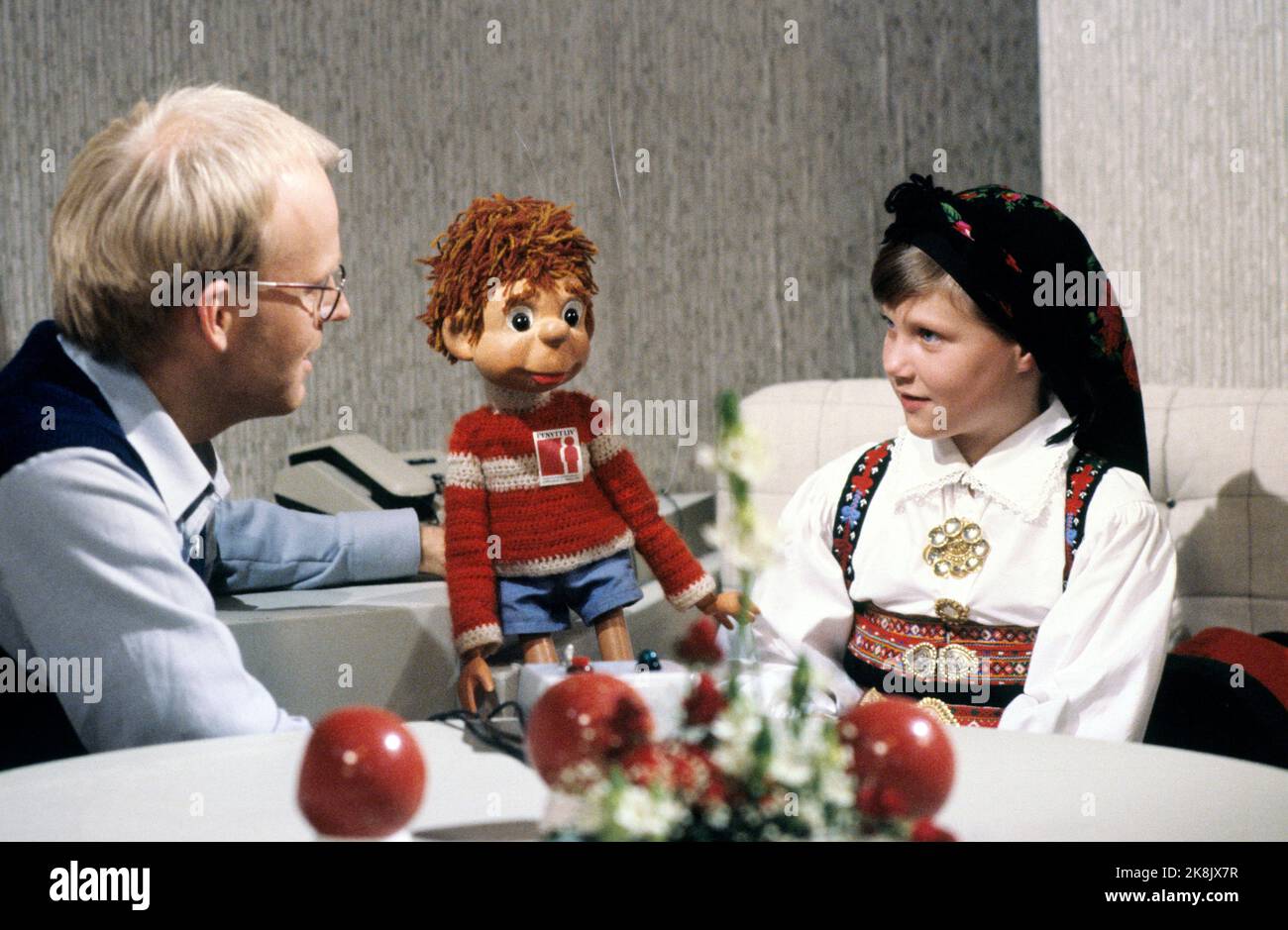 Oslo 19811025: Princess Märtha Louise in the TV studio in connection with the TV action 'A new life'. Together with the princess is the program director Trond-Viggo Torgersen and the children's hour-doll 'Titten Tei'. The princess wearing bunad. Photo: Erik Thorberg / NTB / NTB - - The picture is 47 MB - - - Stock Photo