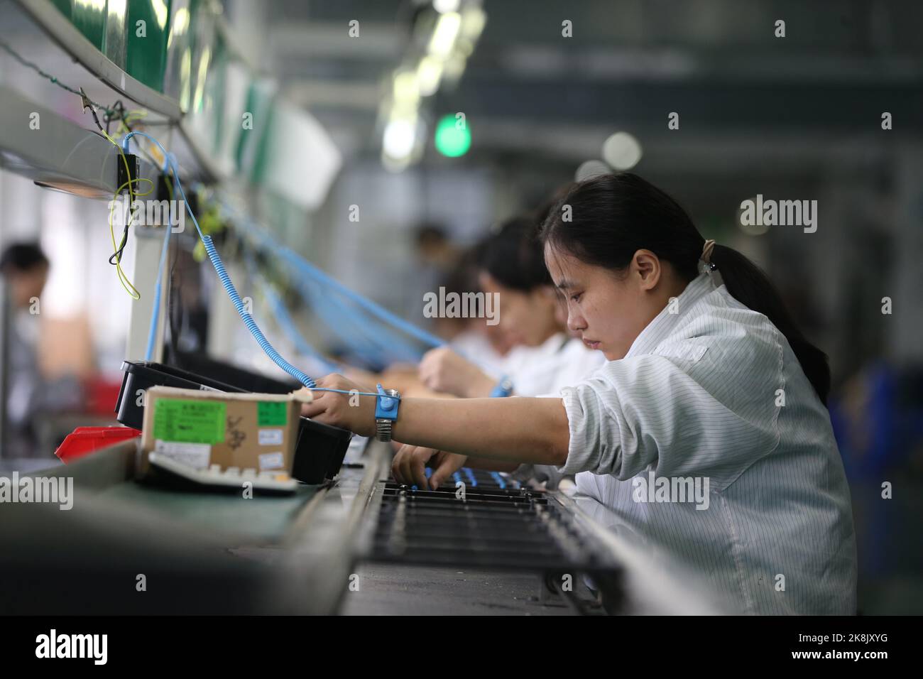MEISHAN, CHINA - OCTOBER 24, 2022 - Workers rush to produce LED drive power products for export in Meishan City, Sichuan Province, China, on Oct 24, 2 Stock Photo