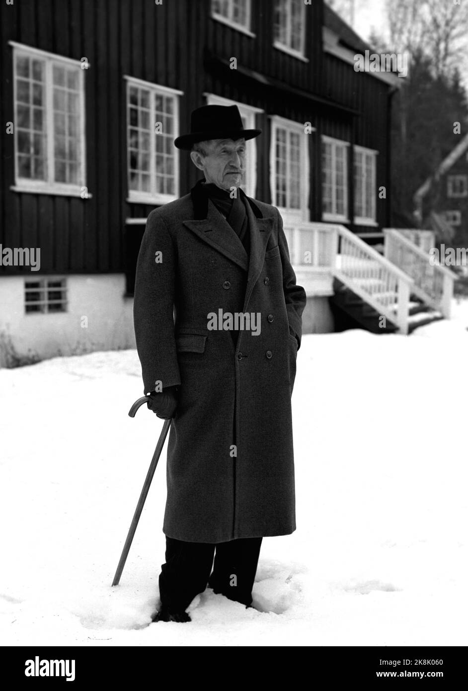 Oslo 19570206. Author Johan Bojer (1872-1959), with cane, hat and winter coat. Snow. Ntb archive photo / ntb Stock Photo