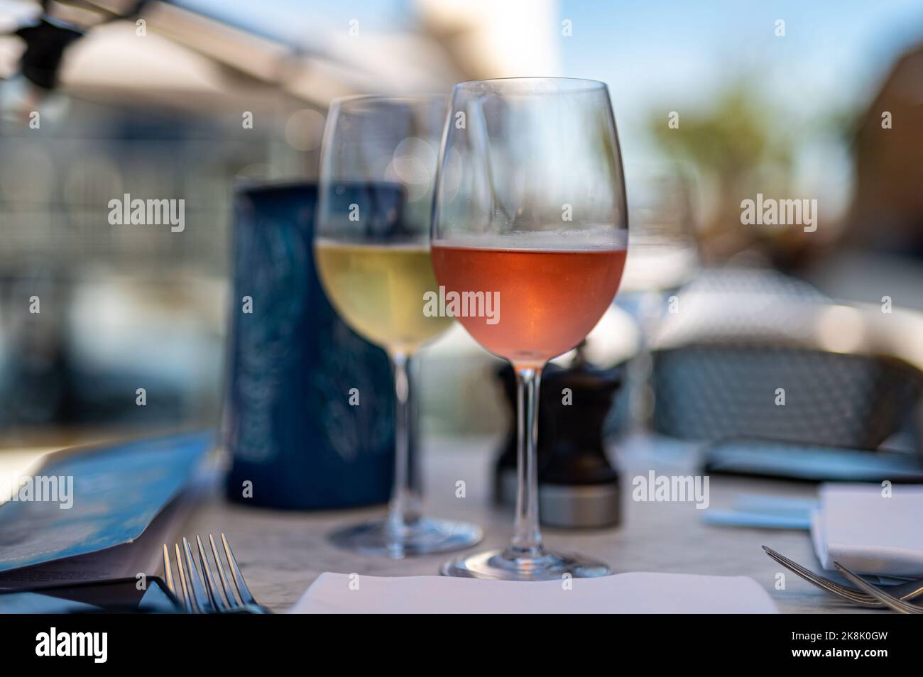 A scenic view of two cups of wine placed on a table Stock Photo
