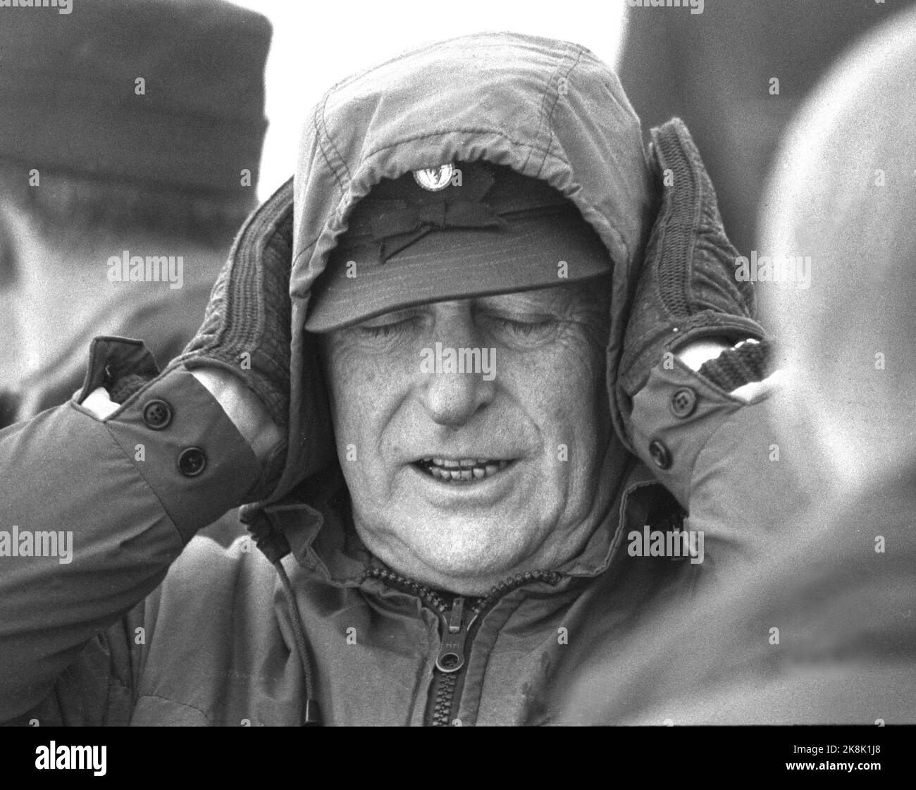 Fåberg 19710220. It can be a little too exciting even for a king. Here we see King Olav close his eyes and stick to his ears during the NM ski in Fåberg. Photo: Erik Thorberg NTB Archive / NTB Stock Photo