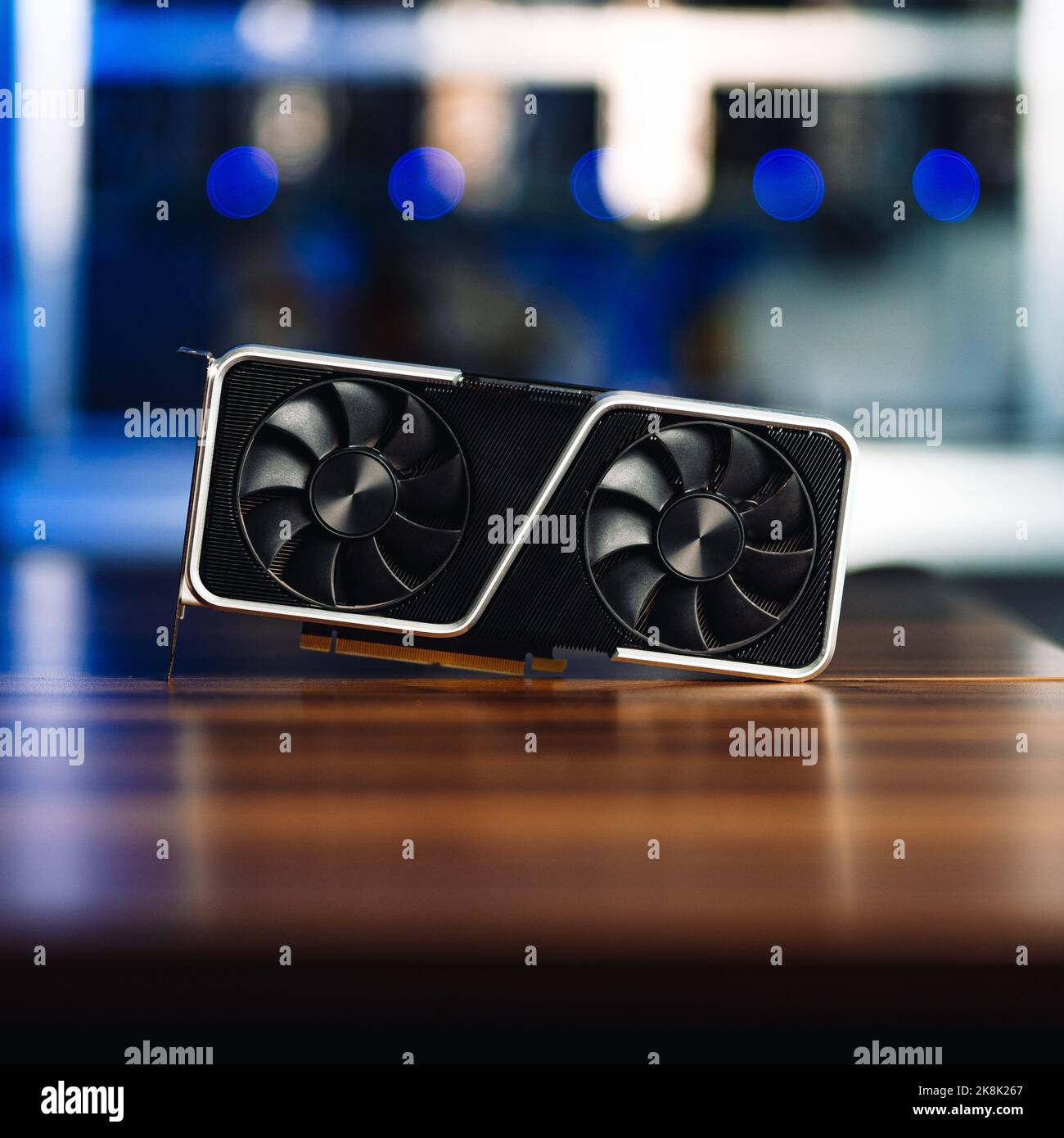 A Cryptocurrency mining GPU rig computer graphics card on the table, close-up Stock Photo