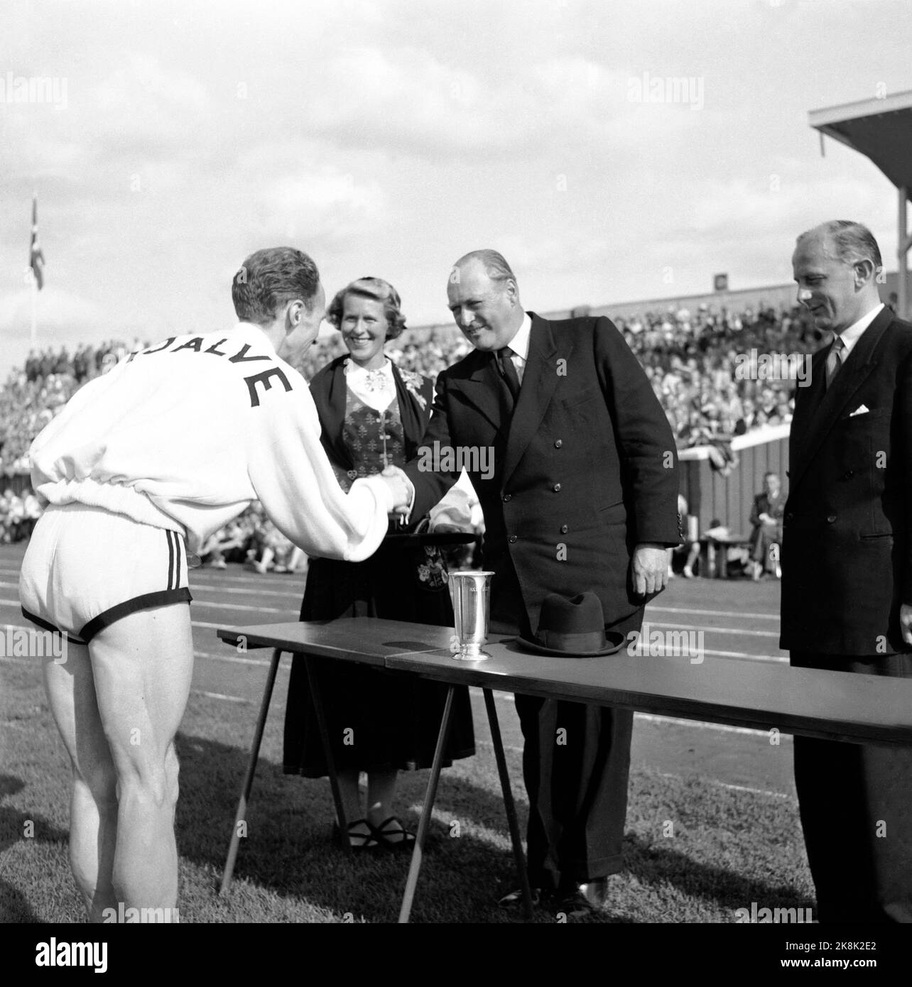 Sarpsborg 19540815 NM in athletics. Audun Boysen's royal trophy. The boys receive the trophy from Crown Prince Olav. Photo: NTB / NTB Stock Photo