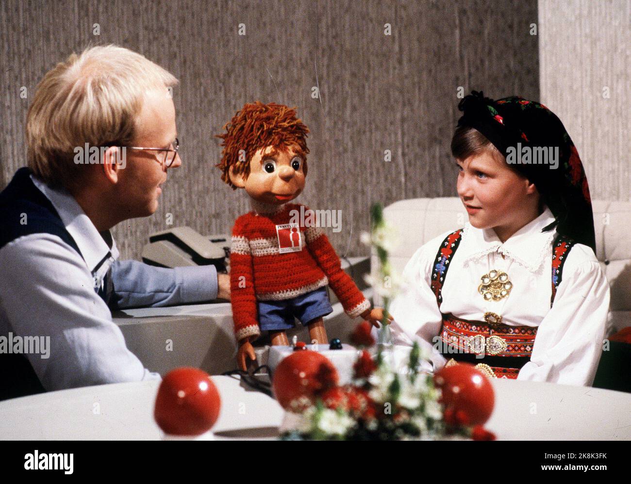 Oslo 19811025: Princess Märtha Louise in the TV studio in connection with the TV action 'A new life'. Together with the princess is the program director Trond-Viggo Torgersen and the children's hour-doll 'Titten Tei'. The princess wearing bunad. Photo: Erik Thorberg / NTB / NTB - - The picture is 15 MB - - - Stock Photo