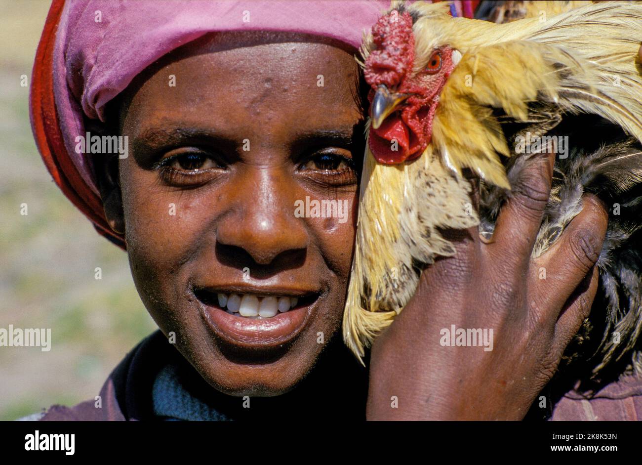 Ethiopia, Addis-Abeba, - Woman shows proudly one of her chickens. Stock Photo