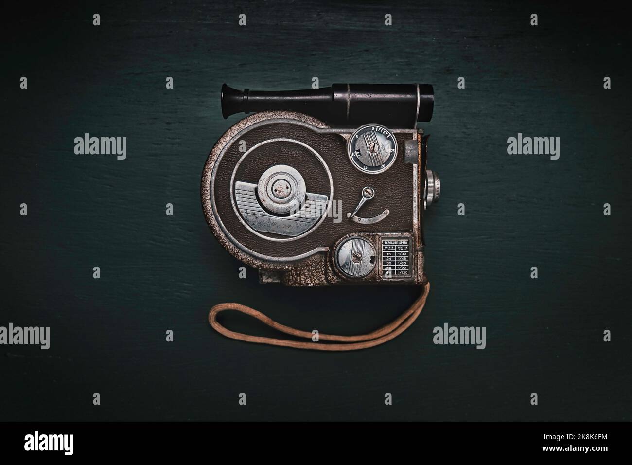 A top view of a vintage cinema camera against a dark background Stock Photo