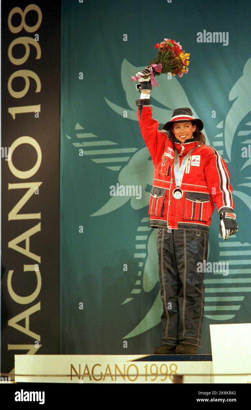 Nagano, Japan 19980213 Winter Olympics in Nagano. Stine Brun Kjeldaas at the victory ceremony Friday after she took silver in Halfpipe in Olympic Games in Nagano, Japan. Kjeldaas in the Norwegian parade attire, with medal and flowers. Photo: Gunnar Lier / NTB Stock Photo