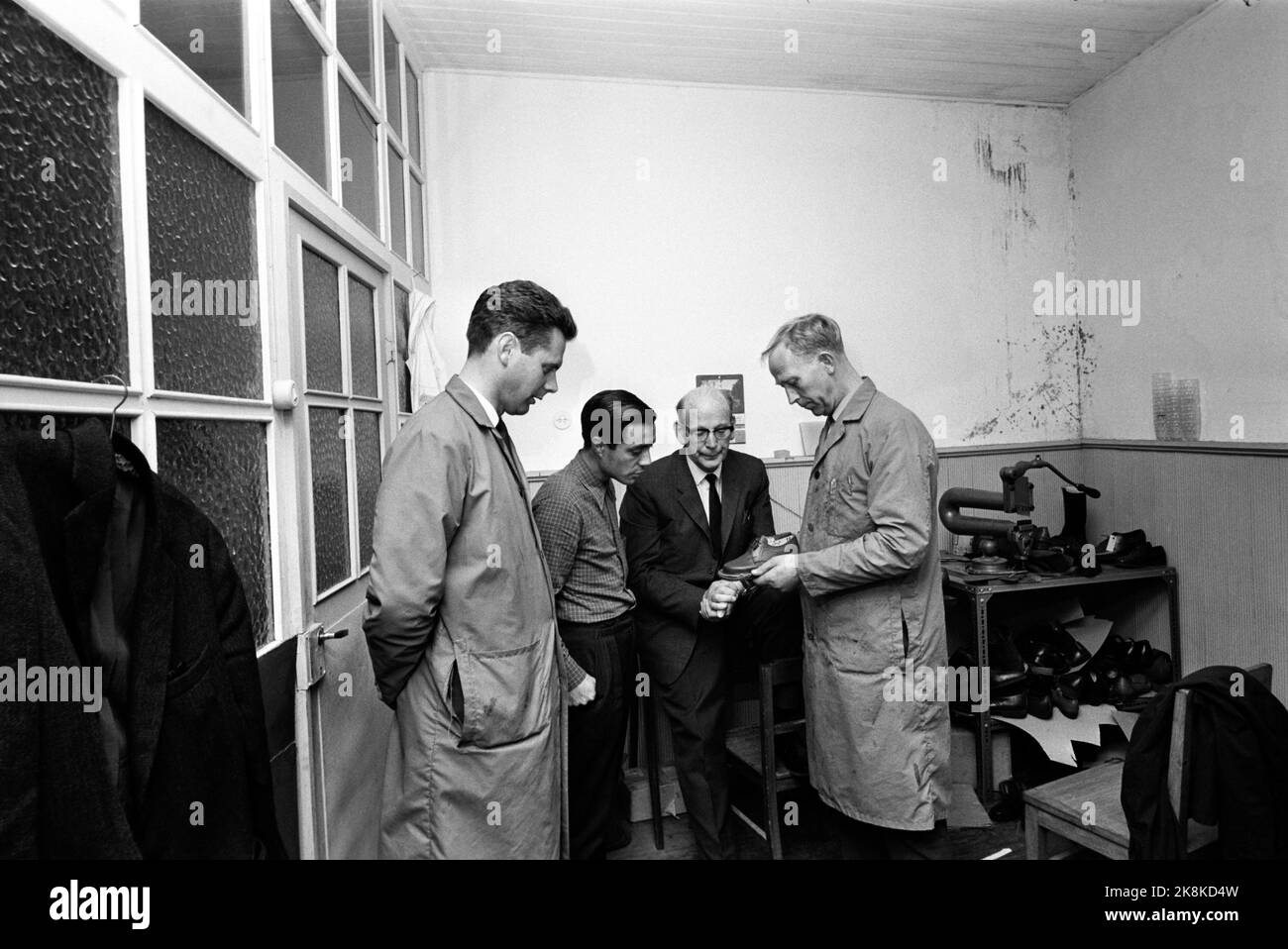 Portugal May 1968 Current visits two Norwegian companies in Portugal. Here, among other things, 14-15 year old girls in the factories for 5 kr. pr. day. There is no trade union, no three weeks of vacation, strikes are prohibited. The factories are established by Norwegian business people. This is from the Vista Alegre shoe factory. The factory is owned by Rolf Hasle from Sandefjord. Rolf Hasle and his son study the finished product. Inspector Harald Mørk T.H Photo: Ivar Aaserud / Current / NTB Stock Photo