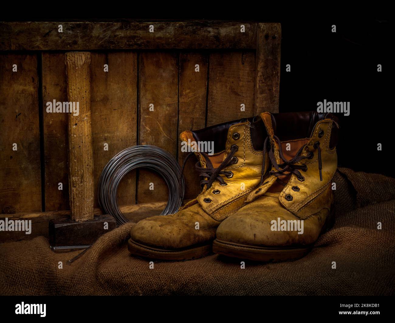Men's old leather work boots with objects. Still life. Stock Photo