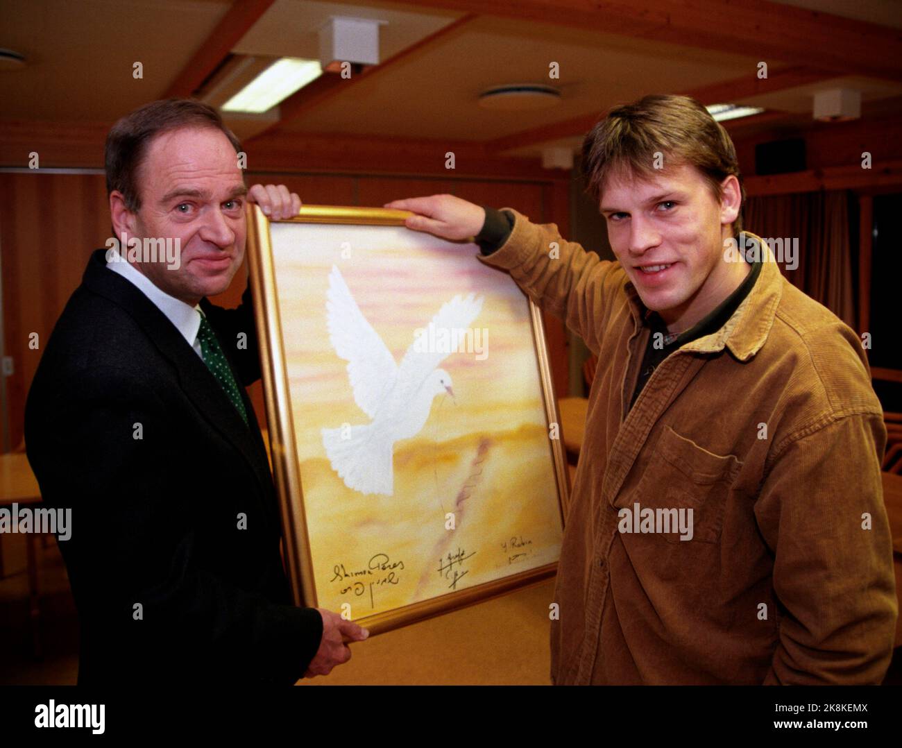 Oslo January 1995. Johann Olav Koss with painting signed by Shimon Peres, Yasir Arafat and Yitzhak Rabin. Peace pigeon. Photo; Knut Falch / NTB Stock Photo