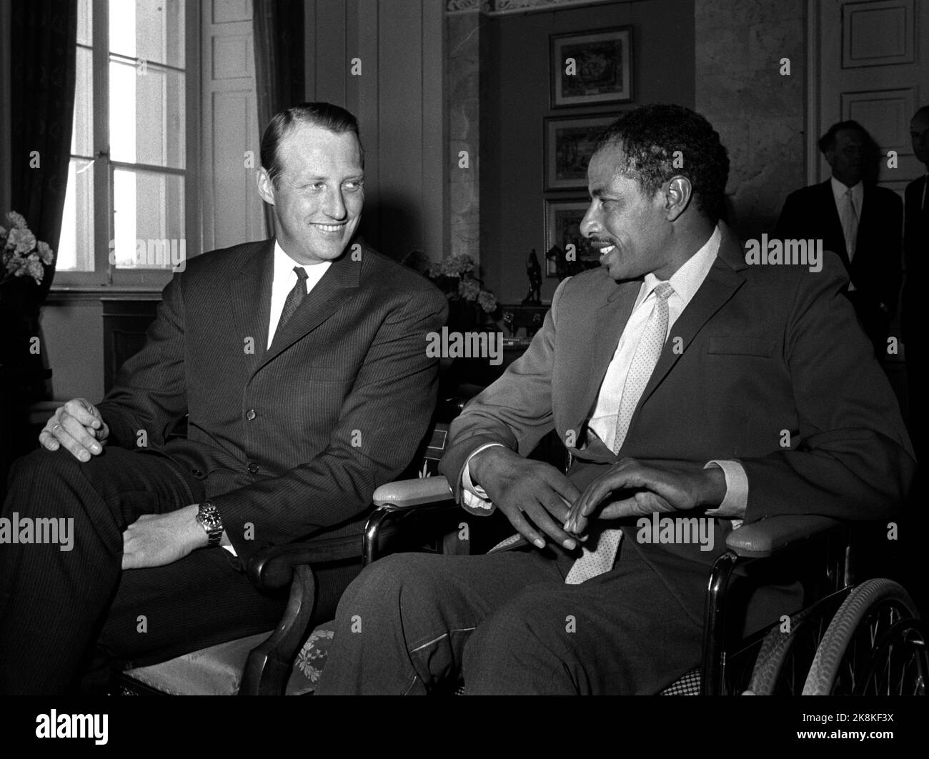 Oslo 19710502 The legendary athlete Abebe Bikila, (1932-1973) who won a marathon in Olympic Games both in 1960 and in 1964, visits Norway. Here Bikila in the audience at Crown Prince Harald. Bikila is in a wheelchair, after he was involved in a car accident in 1968. Photo: NTB / NTB Stock Photo