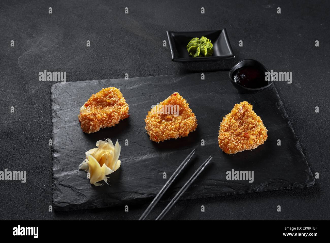 Tofu cheese fried in batter on a griddle. Chinese or Japanese cuisine