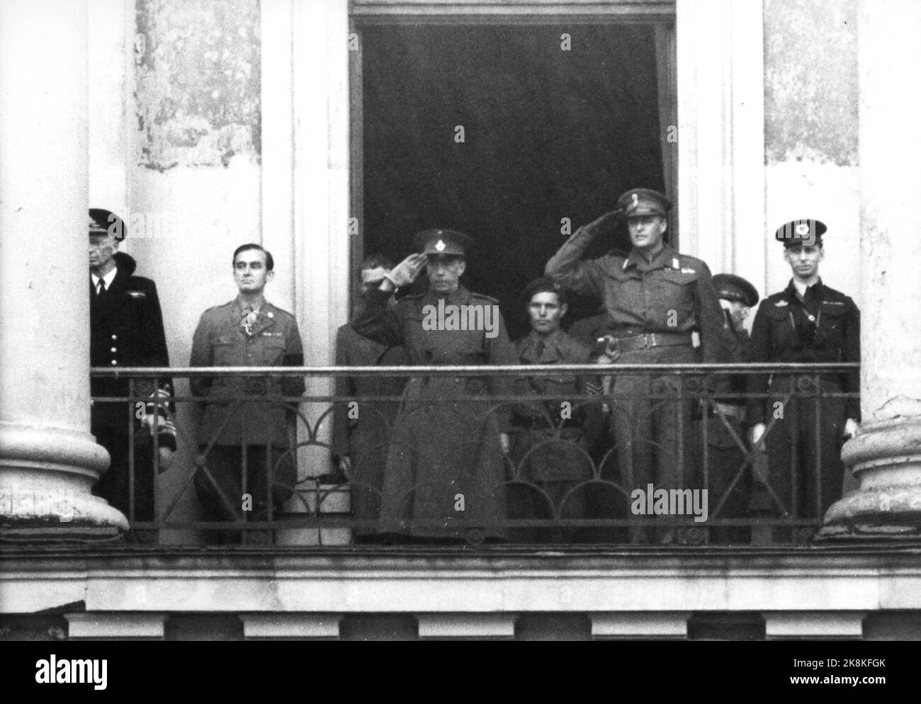 Oslo 19450517: The first May 17 in Oslo after World War II. Crown Prince Olav stood on the castle balcony in Uniform (TH). He is honored. Count Folke Bernadotte stood with him, etc. Photo: NTB Stock Photo