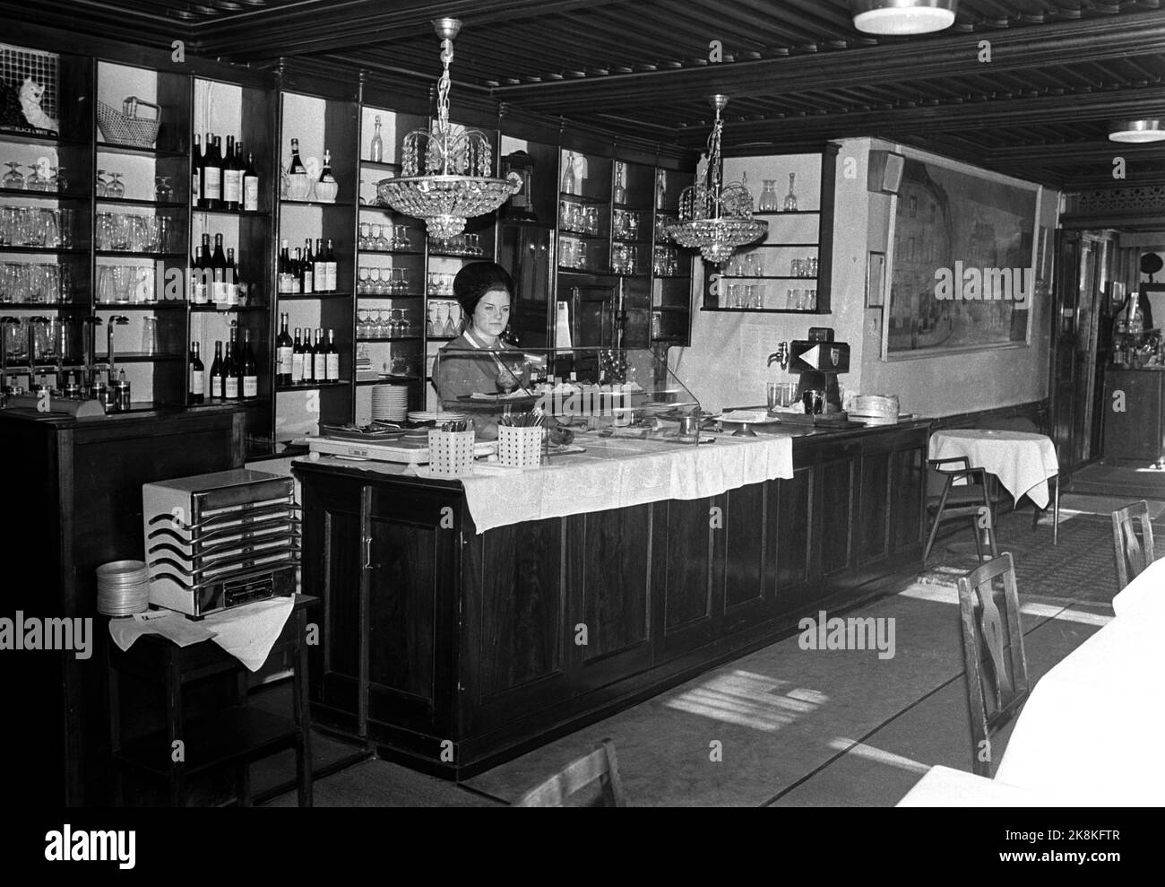 Oslo 19690403 Engebret Cafe. Interior from the restaurant. Woman behind the counter. Photo: Hordnes / NTB Stock Photo