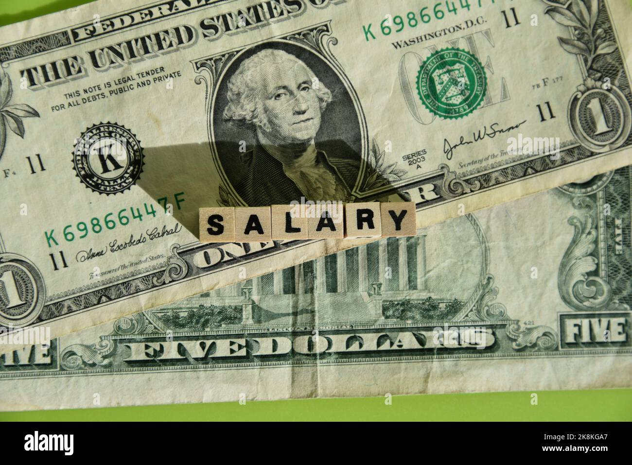 Salary and dollar bank notes Stock Photo Alamy