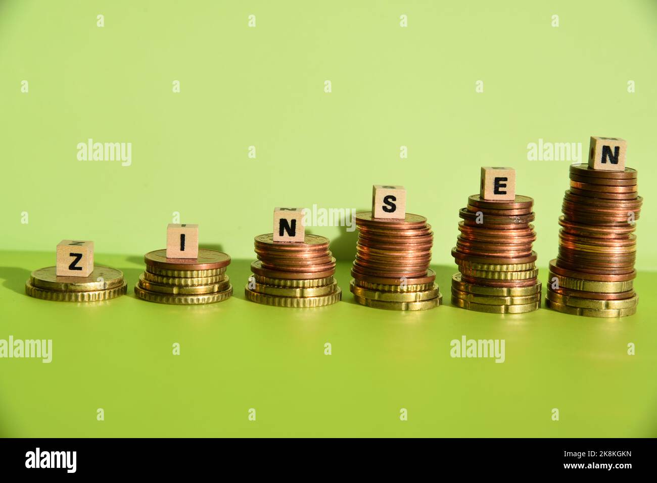 Zinsen and coin stacks Stock Photo