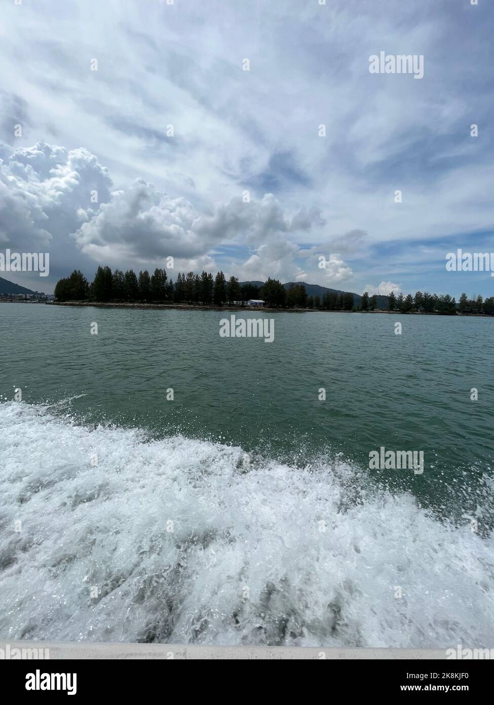 An aerial view of sea surrounded by dense trees Stock Photo - Alamy