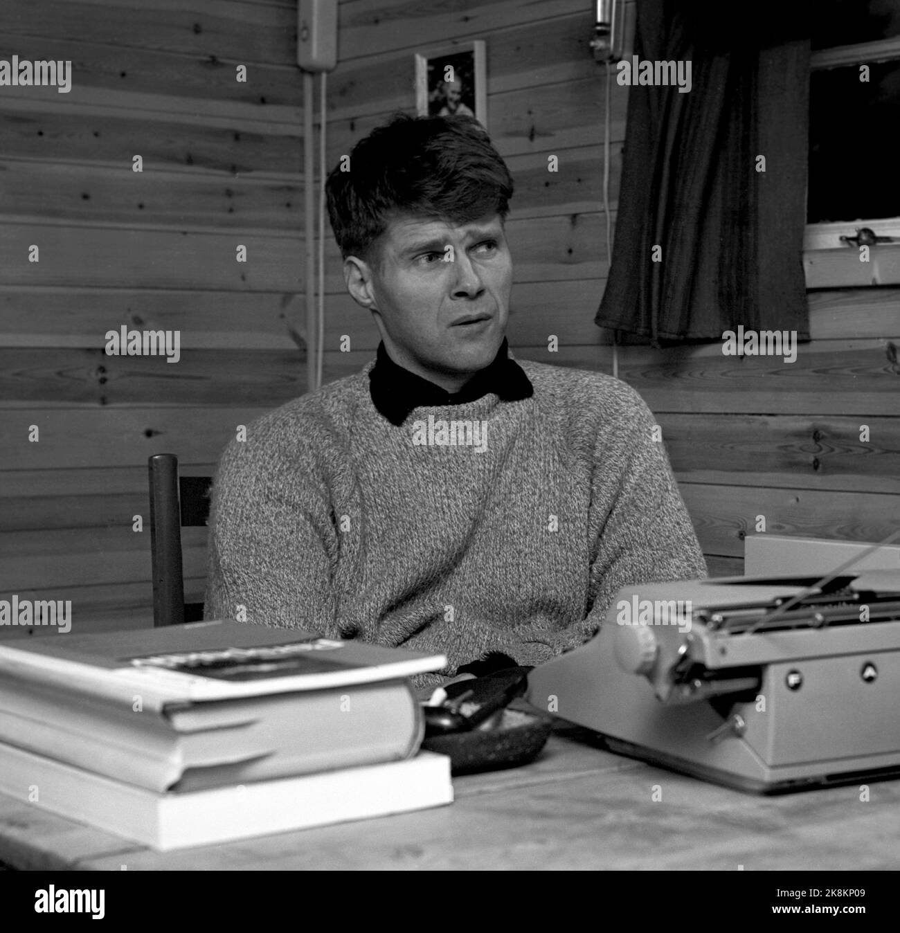 Oslo 196411. Cultural debate in Norway, on cultural funds and turnover tax on weekly magazines, and about Donald Duck. Author Finn Carling has been in the debate. Portrait at the desk in their work room. Photo Ivar Aaserud / Current / NTB Stock Photo