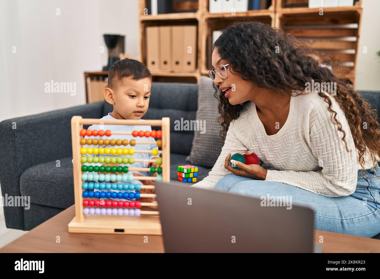 Mother and son having educational therapy at pedagogue center Stock Photo
