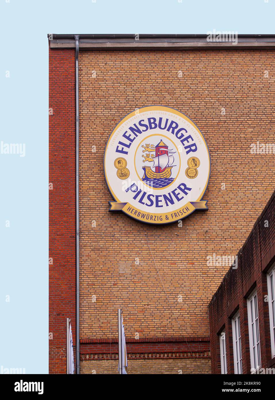 Flensburg Brewery from outside with Flensburger Pilsner logotype sign on the wall. The company was founded on September 6, 1888. Flensburg, Schleswig- Stock Photo