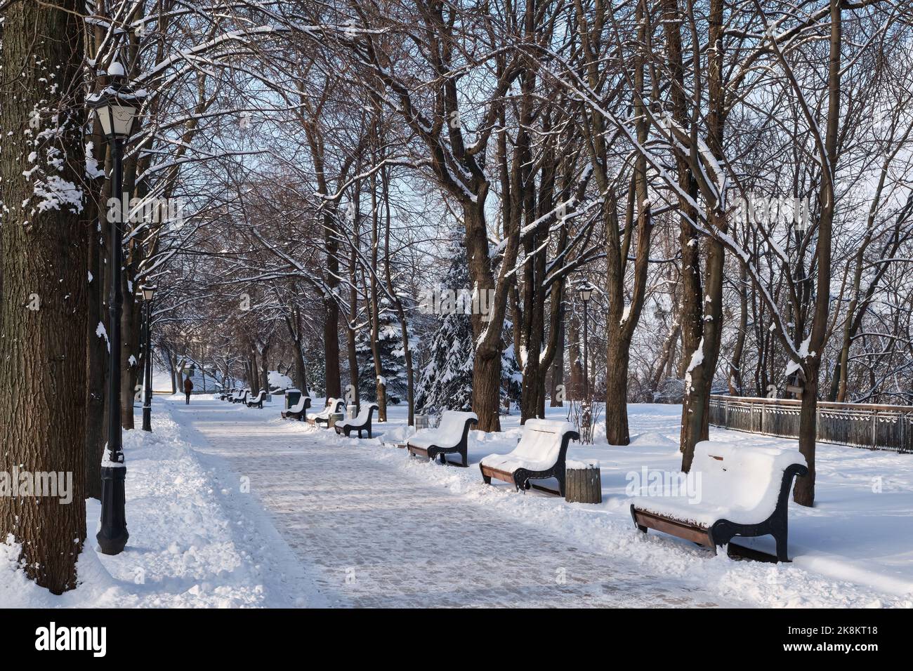 Benches in the winter city park. Filled up with snow. Snow covered ...